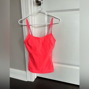 Pink colored Under Armour athletic top.